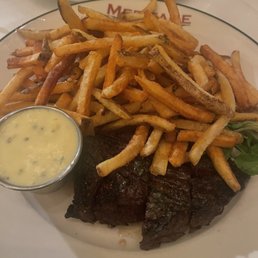 Meritage signature dishes Oysters from the raw bar, Steak Frites, Duck a l'Orange, French Onion Soup